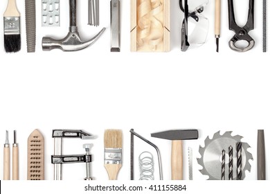 carpentry and woodwork tools on white background. carpenter working table. frame composition with copy space top view