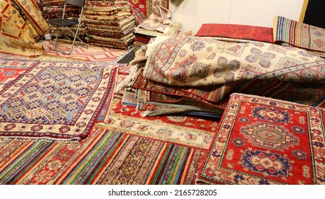 Carpet Shop With Many Woolen Persian Rugs With Colorful Geometric Designs Without People