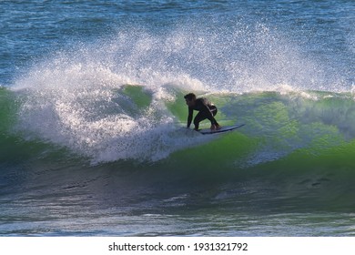 Carpinteria, California USA - 01-04-2016: Surfing the cove at Rincon point