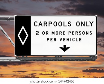 Carpool Only Freeway Sign With Sunset Sky.