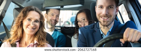 Carpool Ride Share.\
Group Of Friends In\
Taxi