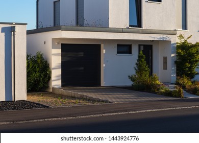 Carport Garage Of Entrace Area Modern Houses At South Germany Summer Evening