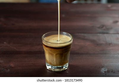 Carrack Tea On Table, Poring Milk 