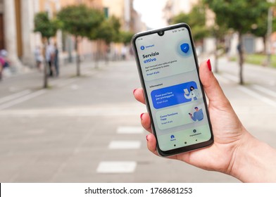 Carrara, Italy - July 03, 2020 - Woman Check The Contact Tracer App Immuni, Developed For The Italian Government, To Monitor Covid-19 Infections In The Area.