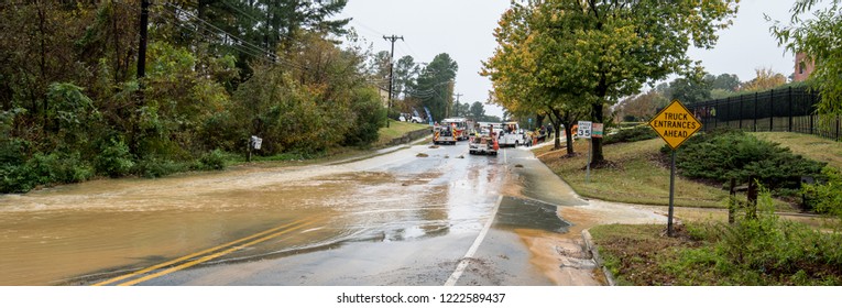Carrboro, NC, US- November 5, 2018:  Firemen and Water Authority workers repairing a broken water main