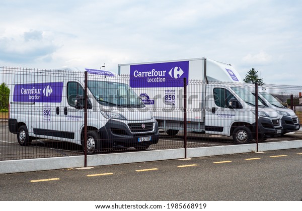 Carrefour Location in France: Front view of\
French truck to rent with logo and signage mockup in Fleche, France\
Carrefour Location is famous brand renting trucks, cars and vans\
Carrefour Location