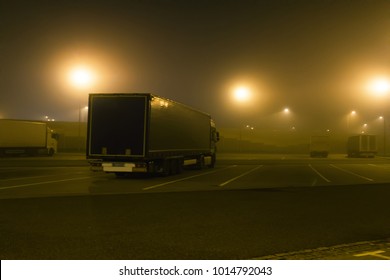 Carriage Of Goods By Road, Trucking Industry - Semi-trailer Truck, Large Goods Vehicle In Parking Lot In Night Fog, Foggy Road