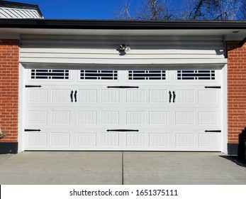 Carriage Style Garage Door With Windows And Barn Door Decorations