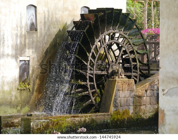 The\
carriage wheel of a water mill in Portogruaro a town on the river\
Lemene in the Province Venice in Veneto in\
Italy