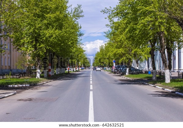 The carriageway of a small provincial\
town Dzerzhinsk, Russia. Sunny summer\
cityscape.