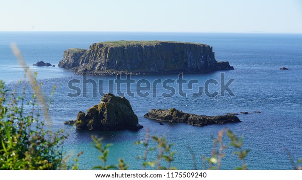 Carrick-a-Rede, Causeway Coast Route in\
a beautiful summer day, Northern Ireland, United\
Kingdom\
