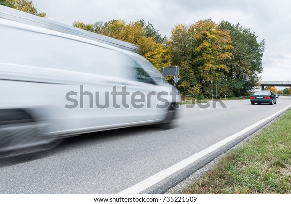 Carrier passing\
by on a national highway,\
Germany