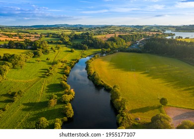 Carrigadrohid Cork Ireland, amazing aerial scenery view on old Irish touristic landmark and meadow and river at sunset  - Powered by Shutterstock