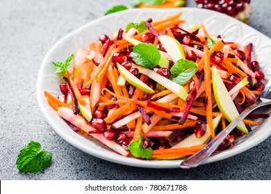 Carrot beetroot apple with lime dressing salad on stone background. Selective focus, copy space. - Powered by Shutterstock