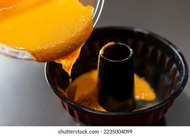 Carrot cake batter being poured into the mold