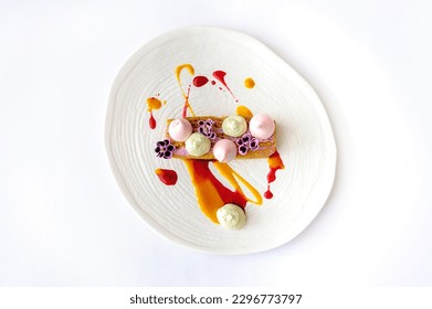 Carrot cake with berry mousse on a white plate isolated - Powered by Shutterstock