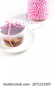 Carrot And Chocolate Jar Cake Minimalist Composition With Plate And Baker Twine String. Food Concept.