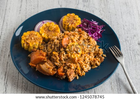 Carrot corn risotto with purple cabbage and onion