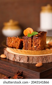 Carrot and dates Christmas cake made with dried fruit, raisins, cashew nuts, almond. Tasty home made cake flavored cinnamon , spices on Christmas new year Kerala India Sri lanka. Sweet dessert food.