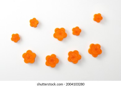 Carrot Flower Sliced Cut On White Background. Close Up Vegan Food Flat Lay Top Angle View Carrots In Flower Shape