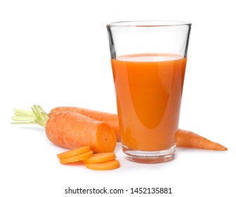 Carrot and glass of fresh juice on white background