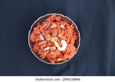 Carrot Halwa With Dry Fruits On Black Background, Gajar Ka Halwa, Image Clicked From Top Surface,