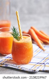 Carrot juice served in glass. Fresh carrot juice served in glass on table. Carrot healthy juice for detox.