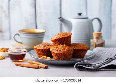 Carrot muffins, cakes with cup of tea. Grey background. - Powered by Shutterstock