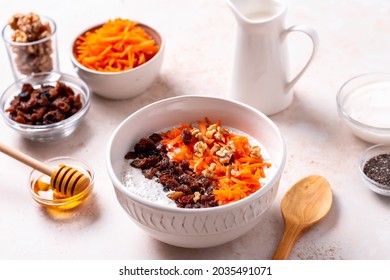 Carrot And Raisins Overnight Oats With Walnuts, High Protein Healthy Breakfast Or Snack On Table With Ingredients, Top View