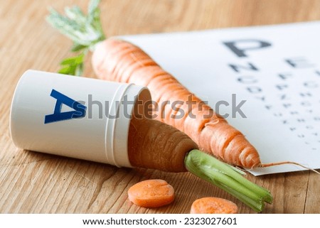 Carrot in vial of vitamin A, natural health for eyesight, concept 