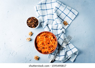 Carrot Walnut Raisin Salad With Glass Of Water. Toning. Selective Focus