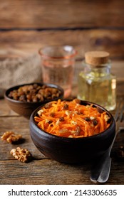 Carrot Walnut Raisin Salad With Glass Of Water. Toning. Selective Focus