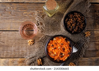 Carrot Walnut Raisin Salad With Glass Of Water. Toning. Selective Focus