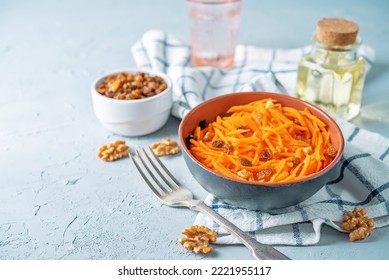 Carrot Walnut Raisin Salad With Glass Of Water. Toning. Selective Focus