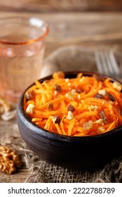 Carrot Walnut Raisin Salad With Glass Of Water. Toning. Selective Focus