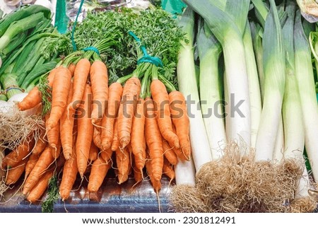 Carrots and leek for sale at a market