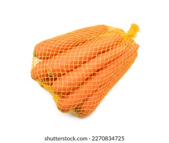 Carrots in a mesh bag isolated on white background