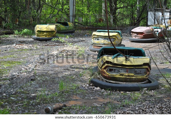 Cars in the\
abandoned city of Pripyat in\
Ukraine