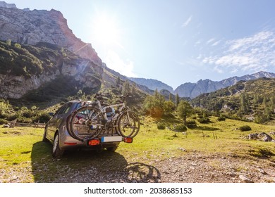 cars with bicycles in the mountains