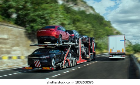 Cars carrier at the road of Romania. Truck transporter