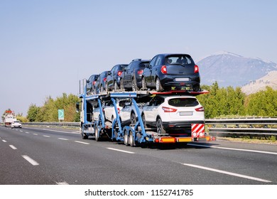 Cars Carrier In The Road. Truck Transporter