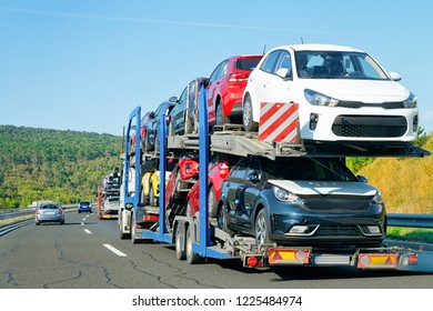Cars carrier truck in the asphalt highway, Poland. Truck transporter