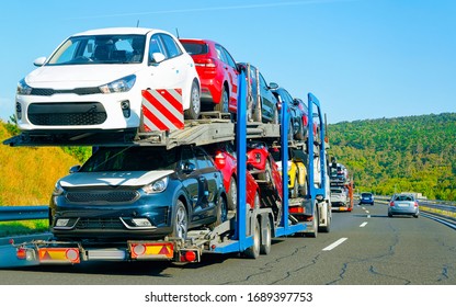 Cars carrier truck in the asphalt highway, Poland. Truck transporter