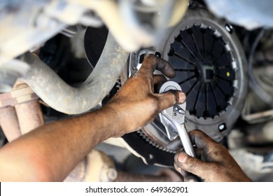 Cars Clutch, Automotive Mechanic Tightening Using A Torque Wrench, Fixed Problem The Clutch Of The Car.