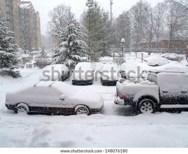 The cars covered by\
snow