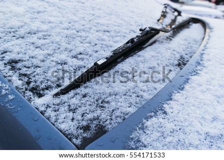 Cars covered with fresh snow