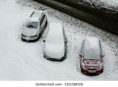 Cars covered with the snow