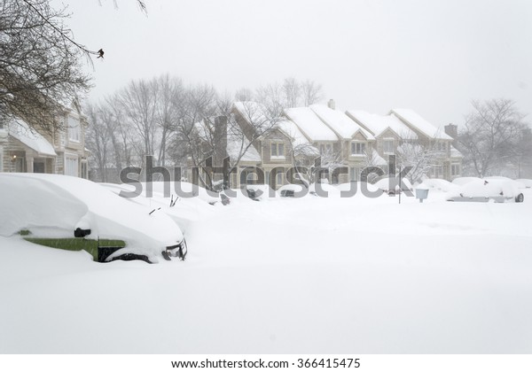 Cars covered\
in snow during snow Blizzard in Washington DC area. Virginia. Bull\
eye of storm. January 23\
2016