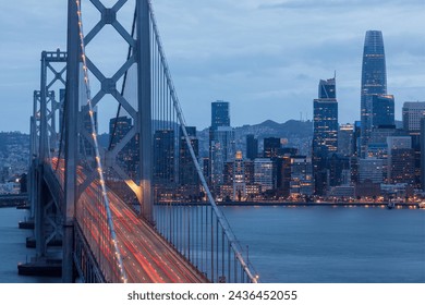 Cars Crossing San Francisco-Oakland Bay Bridges Leaving Light Trails at the Blue Hour. Treasure Island, San Francisco, California. - Powered by Shutterstock