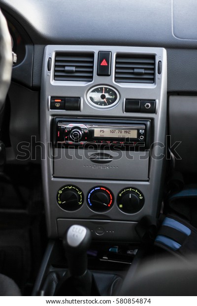 Car\'s\
dashboard central part. Radio and climate\
control.